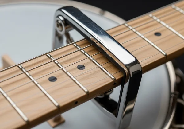 Banjo with a capo on the neck for alternate tunings